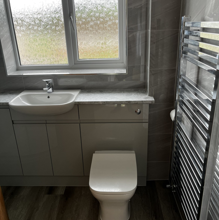 Sink Toilet and heated towel rail bathroom installation