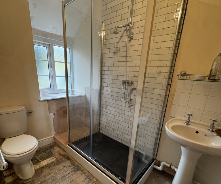 Tiled shower install with sliding guard