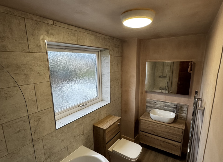 Modern Bathroom Install with Wood Finish on Toilet and Sink