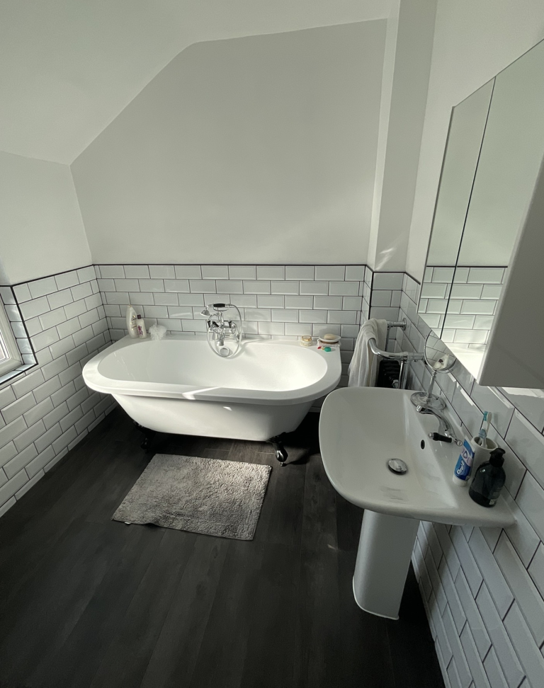 Modern clean bathroom design with large bath